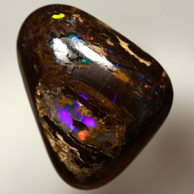 SOLID BOULDER OPAL High dome with very bright rolling flashes of red, orange, yellow, green, blue.